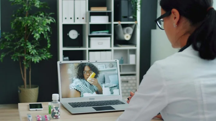 Doctor having a video consultation with a patient
